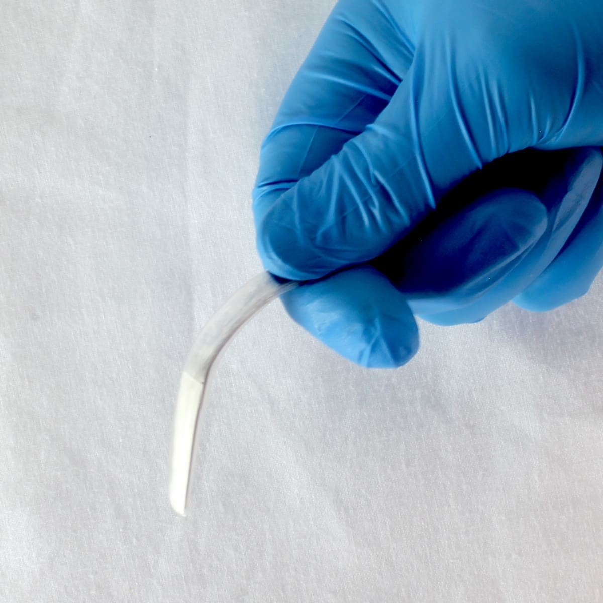 Single-use LightMat providing surgical retractor lighting in cavity